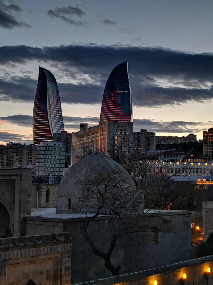 Flame Towers above the Shirvanshahs' Palace at dusk